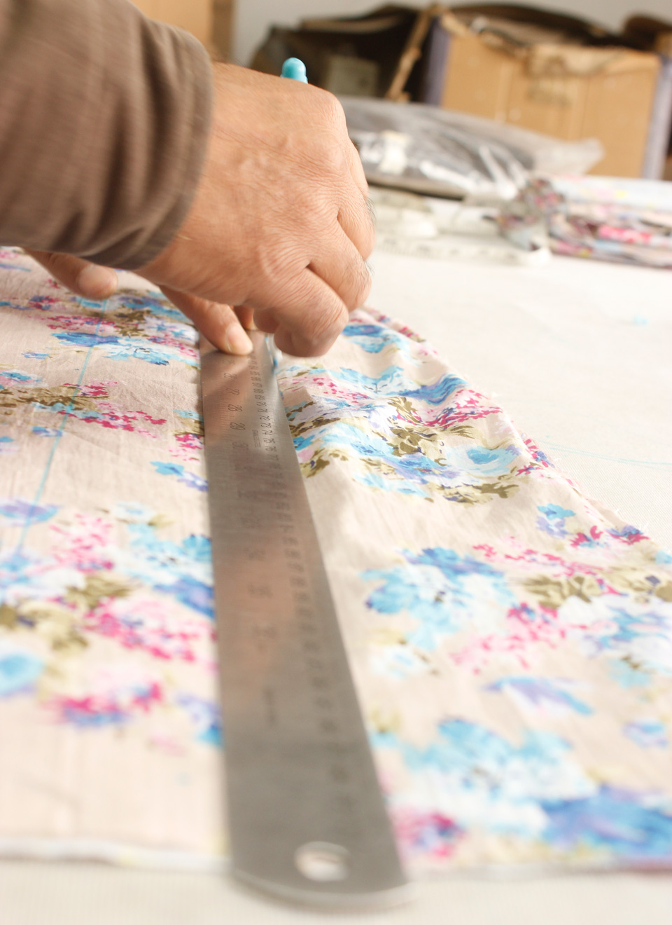 marking the fabric for cutting in our dedicated cutting room.