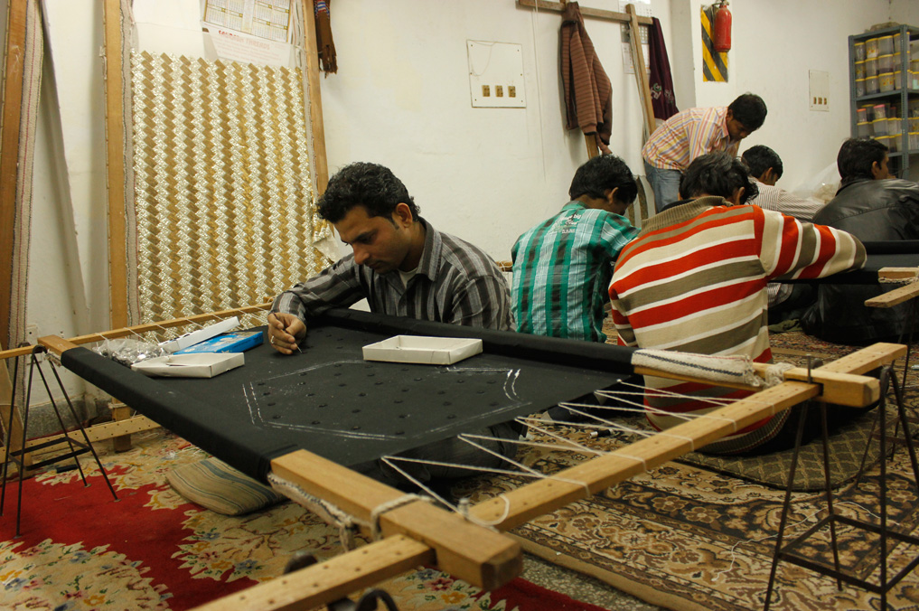 'addas', or embroidery frames, fill up the room where artisans work to develop stunning hand embroidered pieces.