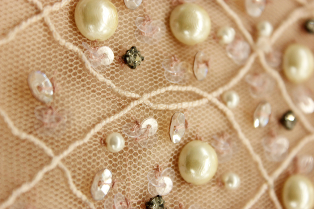 'dori', or cord machine embroidery enhanced with hand embroidered pearls, stones and sequins.